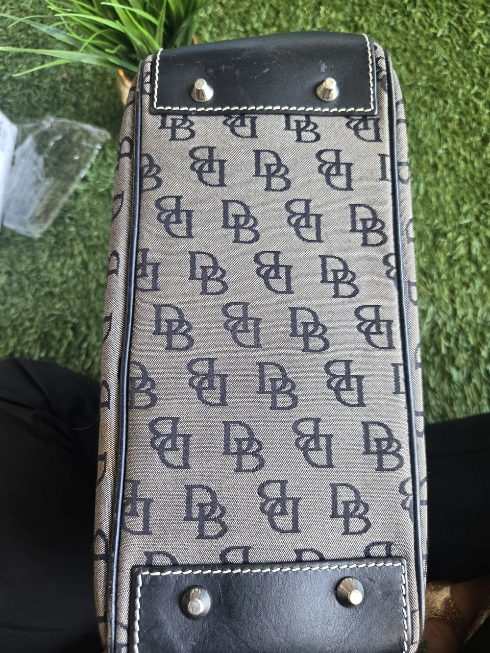 Dooney & Bourke Beige and Black Monogram Satchel with Buckle Accent